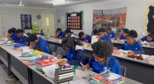 SPIA students working at desks in an academic classroom